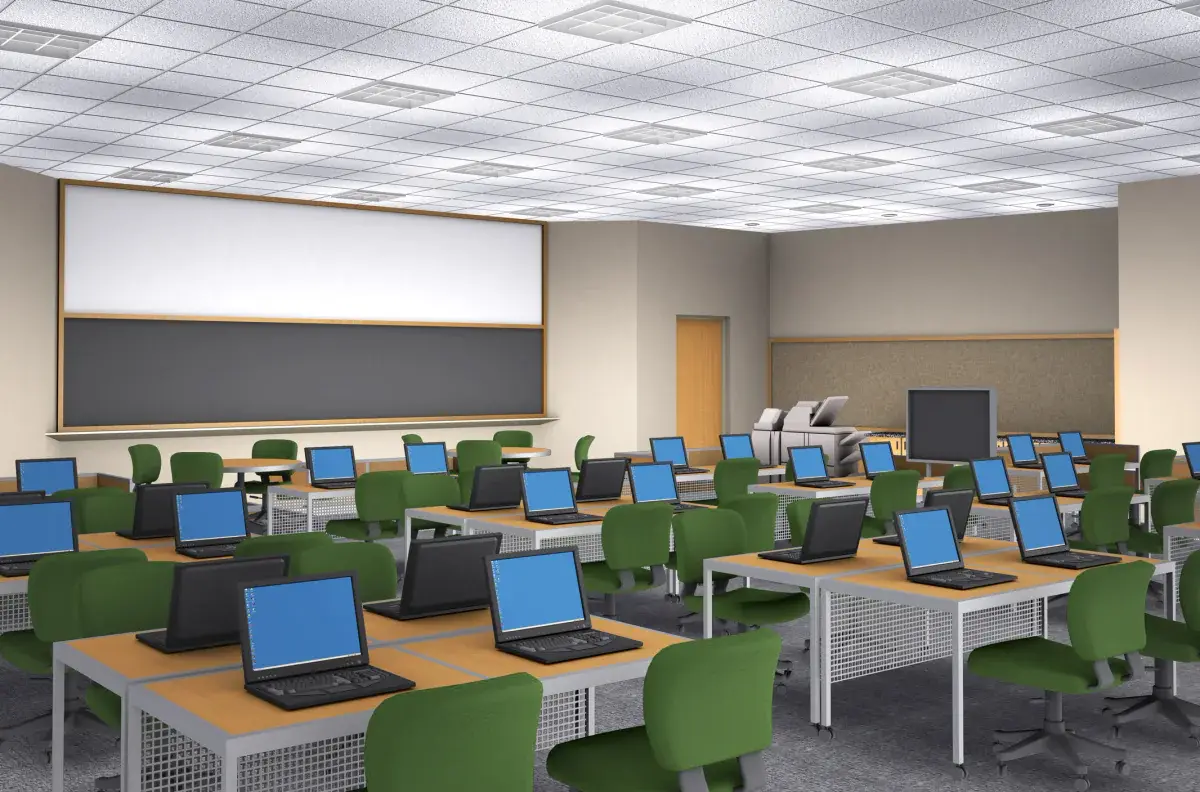 Large room filled with rows of matching laptops set up for a deployment